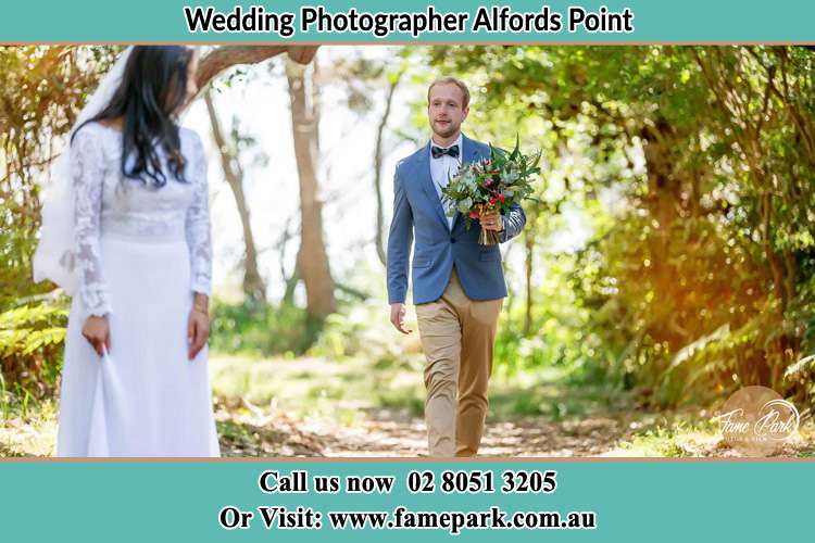 Photo of the Groom bringing flower to the Bride Alfords Point NSW 2234