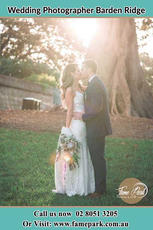 Photo of the Bride and the Groom kissing at the yard Barden Ridge NSW 2234