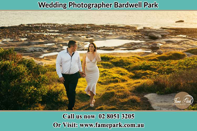 Photo of the Groom and the Bride walking near the lake Bardwell Park NSW 2207