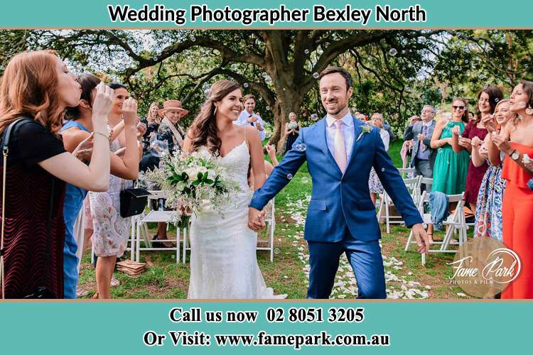 Photo of the Bride and the Groom showering bubbles by the visitors Bexley North NSW 2207