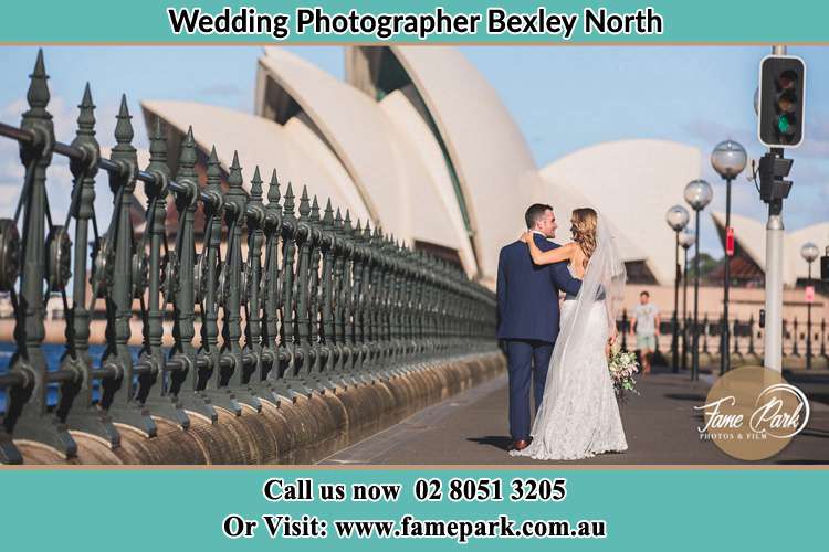 The Groom and the Bride walking towards the Sydney Grand Opera House Bexley North NSW 2207