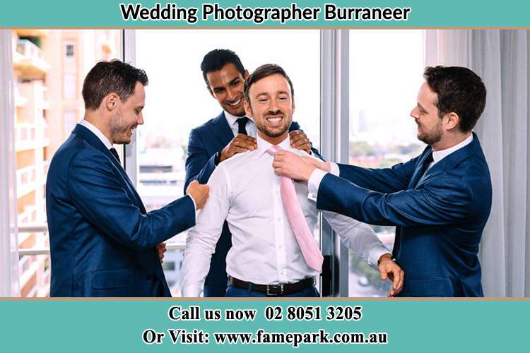 Photo of the Groom helping by the groomsmen getting ready Burraneer NSW 2230