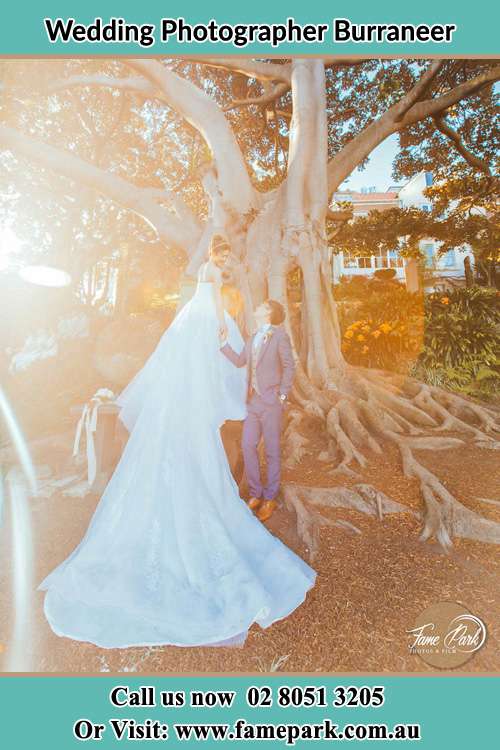 Photo of the Bride and the Groom looking each other beside the tree Burraneer NSW 2230