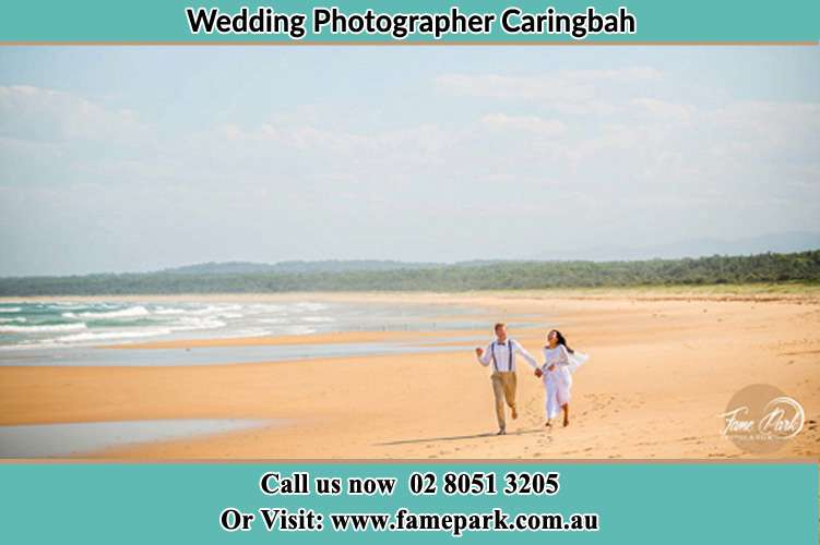 Photo of the Groom and the Bride walking at the sea shore Caringbah NSW 2229