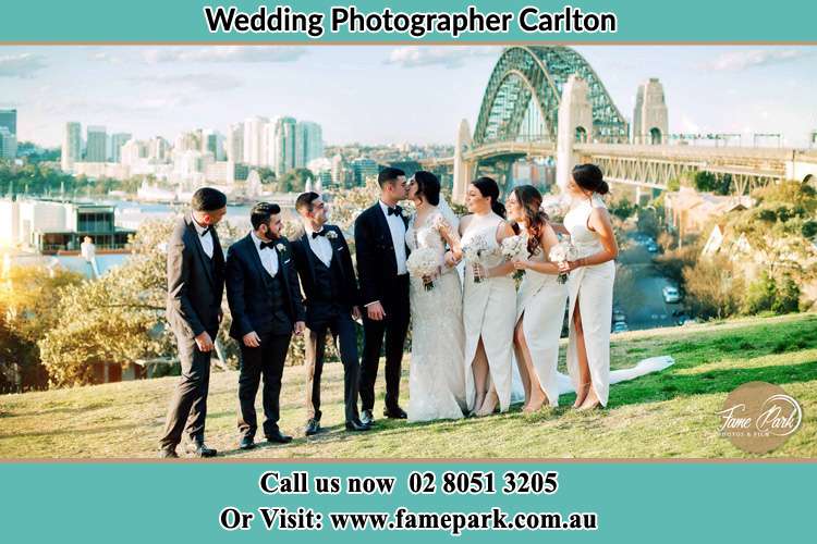 Photo of the Groom and the Bride with the entourage near the bridge Carlton NSW 2218