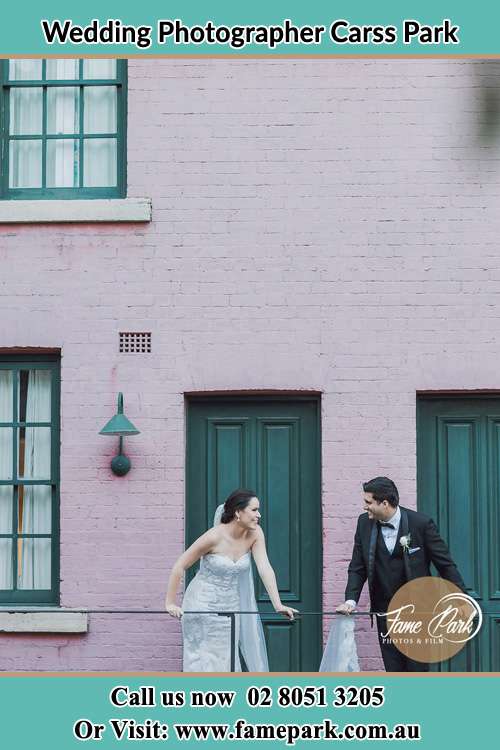 Photo of the Groom and the Bride looking each other at the balcony Carss Park NSW 2221