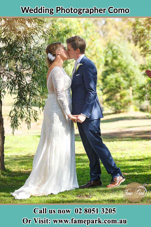 Photo of the Bride and the Groom kissing at the yard Como NSW 2226