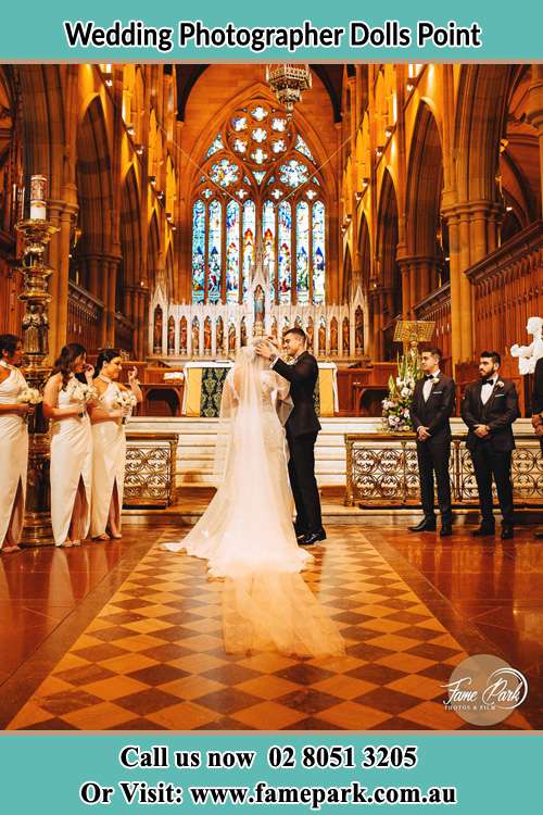 Photo of the Groom and the Bride with the entourage at the altar Dolls Point NSW 2219