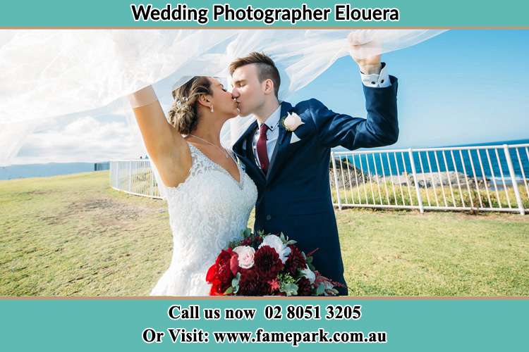 Photo of the Bride and the Groom kissing at the yard Elouera NSW 2230