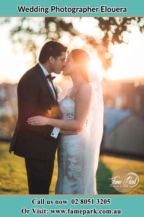 Photo of the Groom and the Bride kissing at the yard Elouera NSW 2230