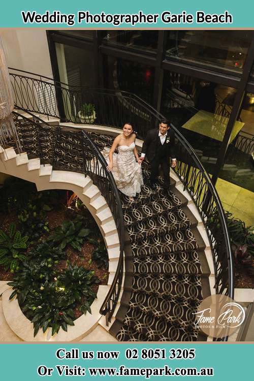 Photo of the Bride and the Groom going down the stair Garie Beach NSW 2233