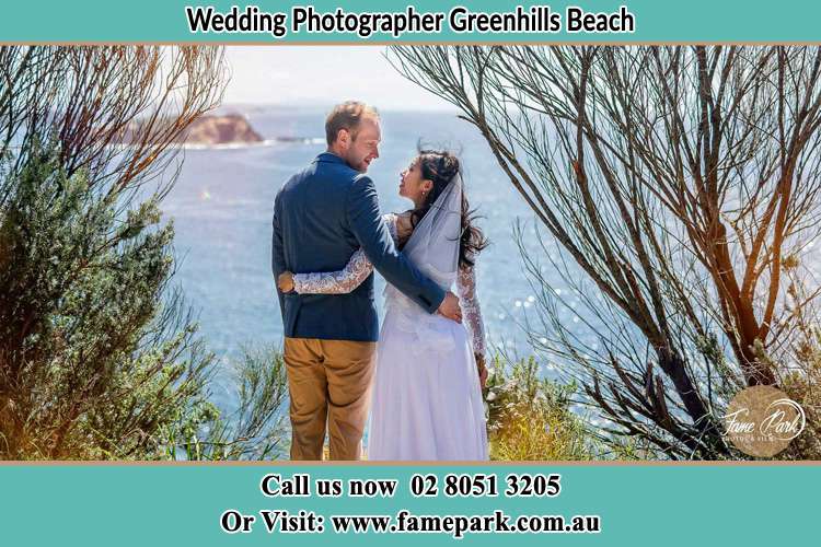 Photo of the Groom and the Bride looking each other near the sea front Greenhills Beach NSW 2230