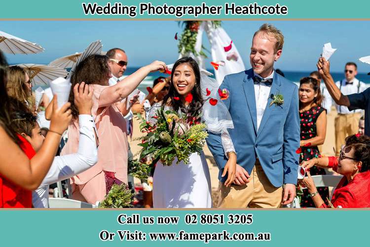 Photo of the Bride and the Groom showering flower petal by the visitors Heathcote NSW 2233