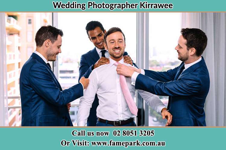 Photo of the Groom helping by the groomsmen getting ready Kirrawee NSW 2232