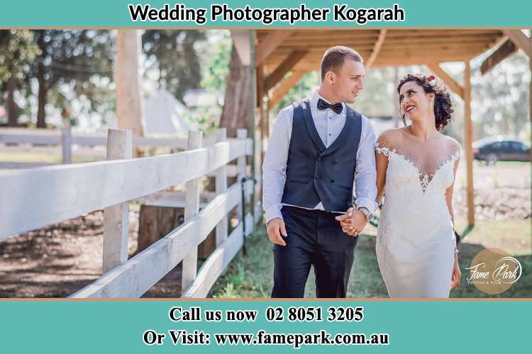 Photo of the Groom and the Bride holding hands while walking Kogarah NSW 2217