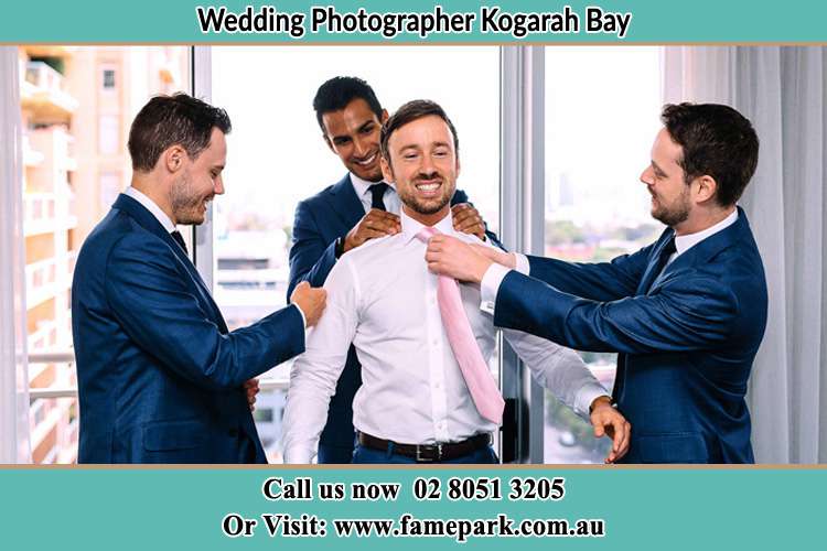 Photo of the Groom helping by the groomsmen getting ready Kogarah Bay NSW 2217