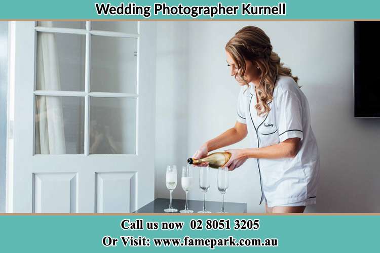 Photo of the Bride pouring wine on the glasses Kurnell NSW 2231