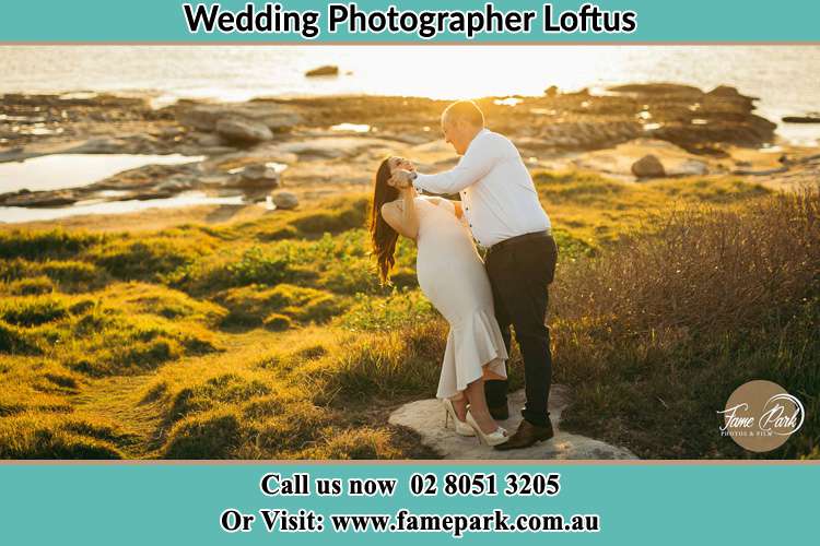 Photo of the Bride and the Groom dancing near the lake Loftus NSW 2232