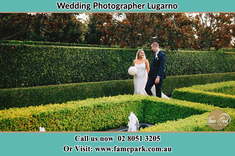 Photo of the Bride and the Groom walking at the garden Lugarno NSW 2210