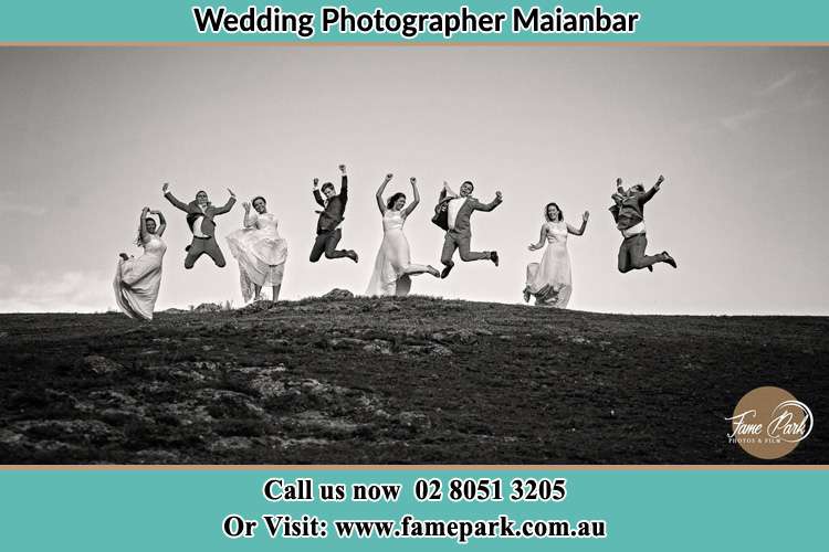 Jump shot photo of the Groom and the Bride with the entourage Menai NSW 2234