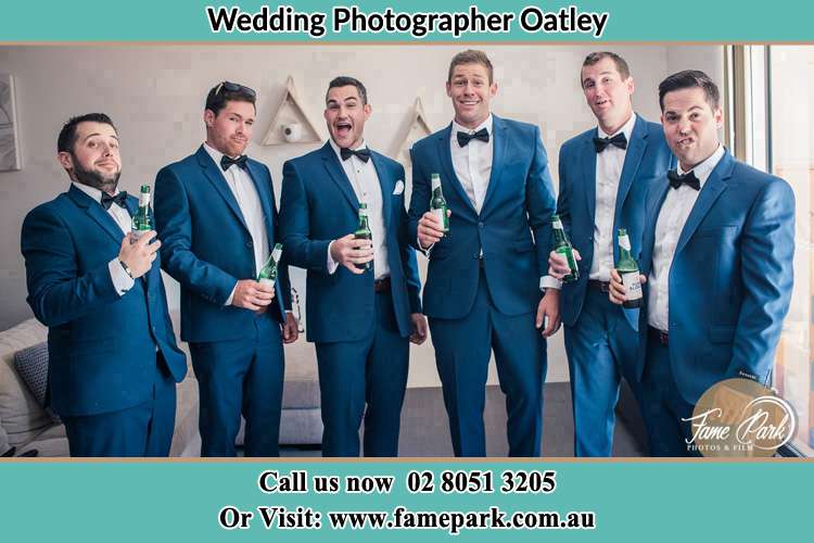 The groom and his groomsmen striking a wacky pose in front of the camera Oatley NSW 2223