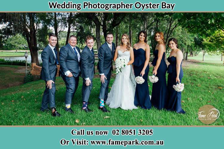 The Bride and the Groom with their entourage pose for the camera Oyster Bay NSW 2225