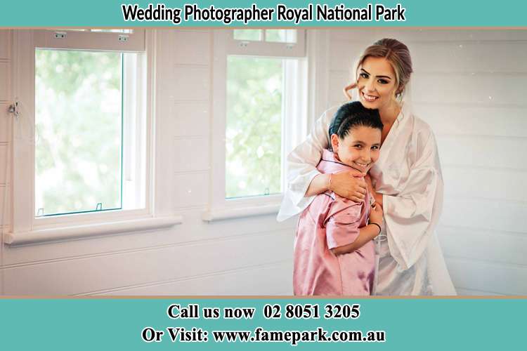 Photo of the Bride hugging the flower girl Royal National Park NSW 2233