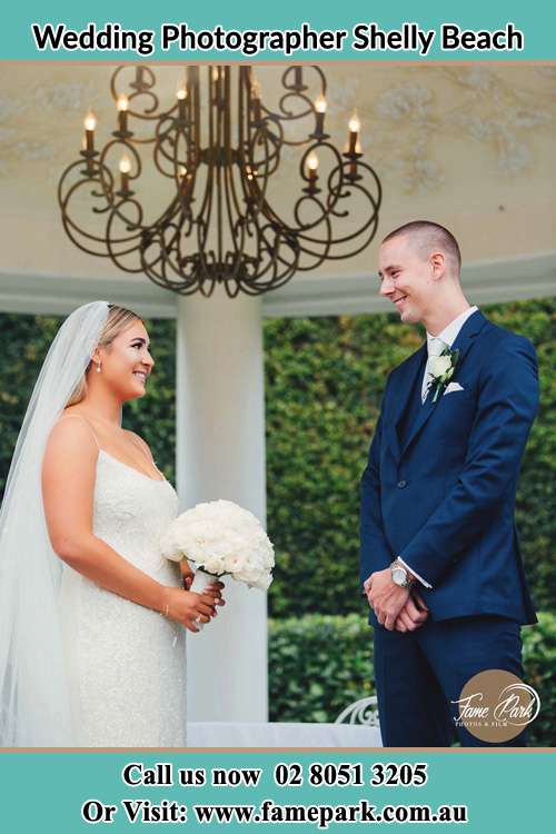 Photo of the Bride and the Groom happily looking each other Shelly Beach NSW 2261