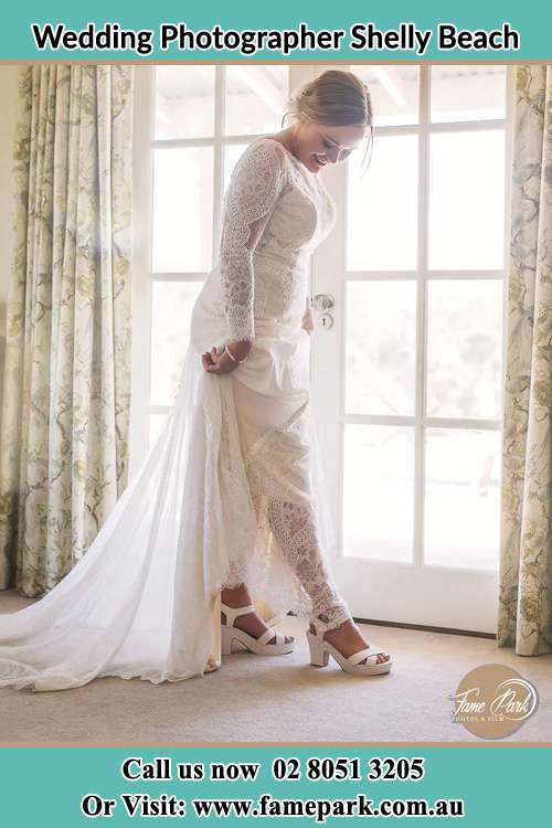 Photo of the Bride checking her shoes Shelly Beach NSW 2261