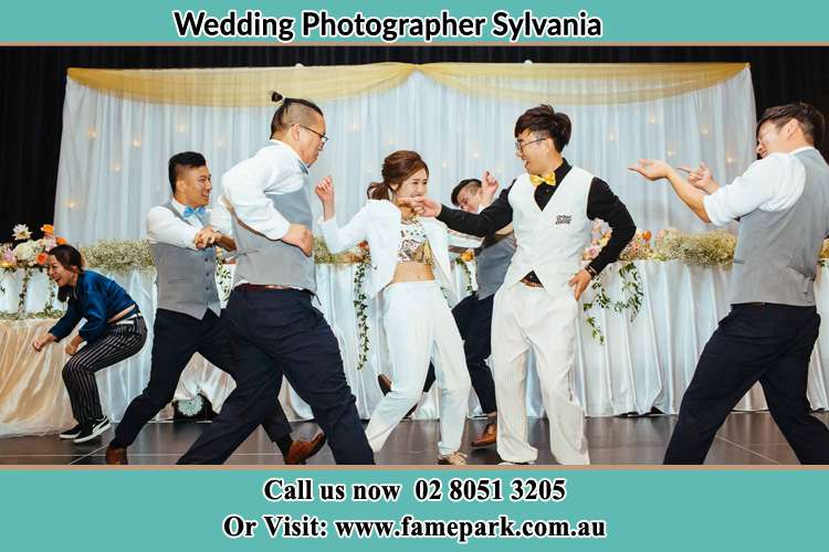 Photo of the Groom and the Bride dancing with the groomsmen on the dance floor Sylvania NSW 2224