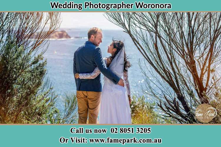 Photo of the Groom and the Bride looking each other near the sea front Woronora NSW 2232